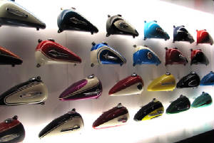wall full of painted harley gas tanks.jpg
